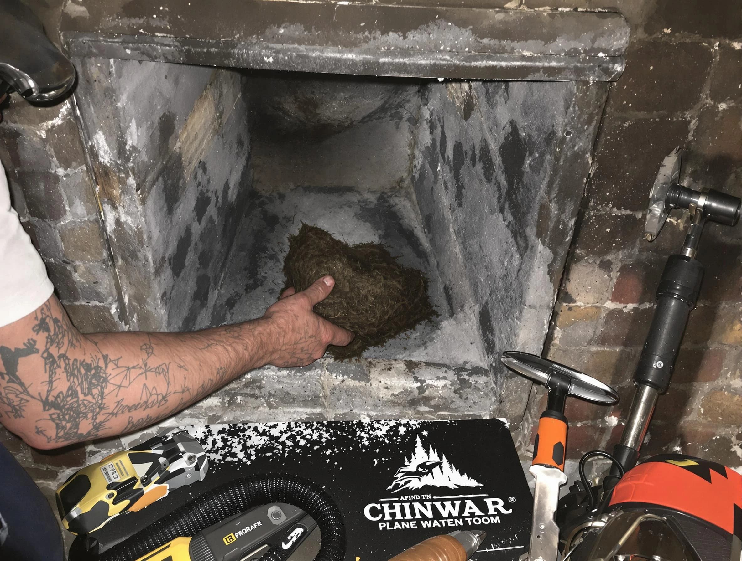 Union City Chimney Sweep safely removing debris and screening chimney in Union City, GA